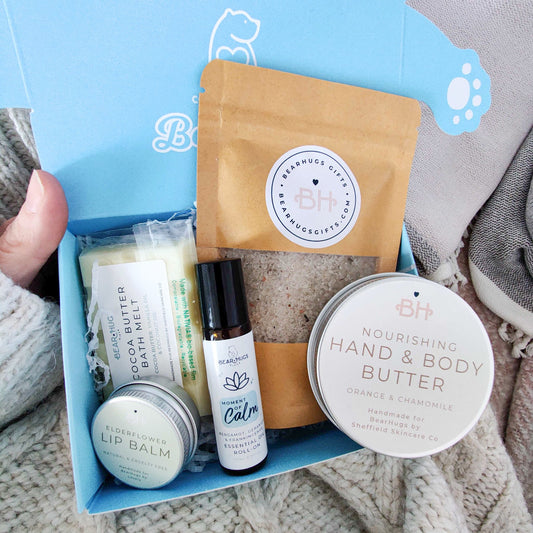 Sensitive Bereavement and Loss Gifts To Send: A BearHugs hug in a box care package containing a bath melt, bath salts, lip balm, a calming essential oil roll on and nourishing hand and body butter.